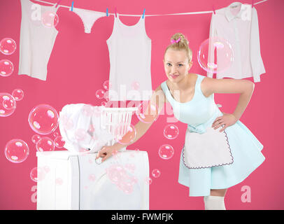 Young housewife overwhelmed by tasks associated with running a home. Stock Photo