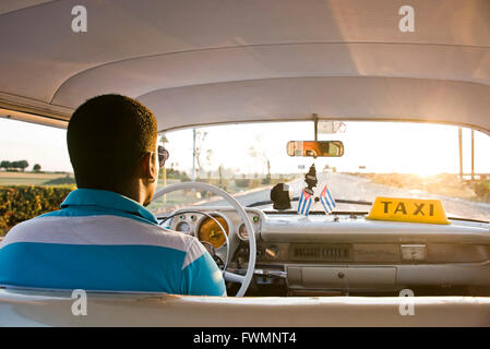 Horizontal view sitting inside a classic old American car in Cuba. Stock Photo