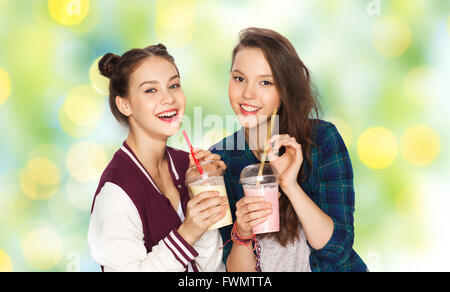 happy pretty teenage girls drinking milk shakes Stock Photo