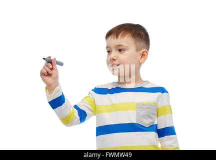 little boy drawing or writing with marker Stock Photo