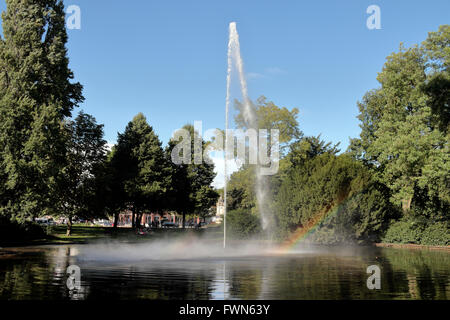Stunning fountain producing a rainbow in Park Valkenberg, Breda, North Brabant, Netherlands. Stock Photo