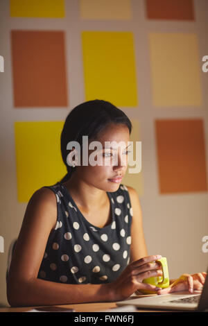 Late night browsing from the office Stock Photo