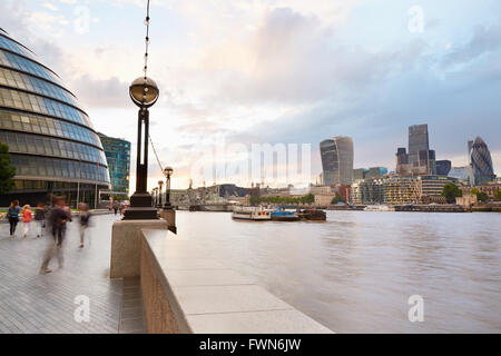 City Hall building and London skyline with people walking in the afternoon Stock Photo