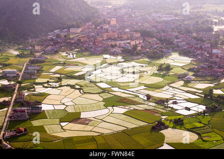 Sunset over the Bacson Valley and the reflection in the paddy field in Vietnam Stock Photo