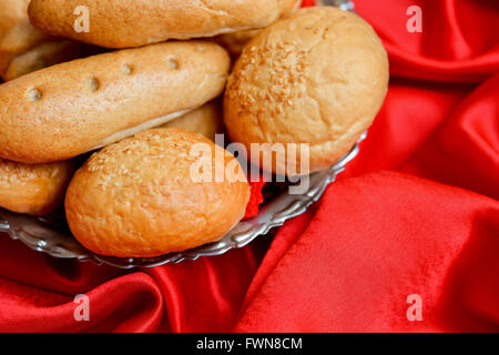 Different types of bread placed in stainless steel bowl Stock Photo