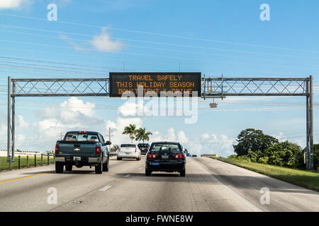 Electronic variable message board on matrix billboard on highway in Florida warning drivers not to text and drive, United States Stock Photo