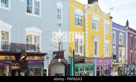 Colourful shop fronts in the high street. Glastonbury, Somerset, England Stock Photo