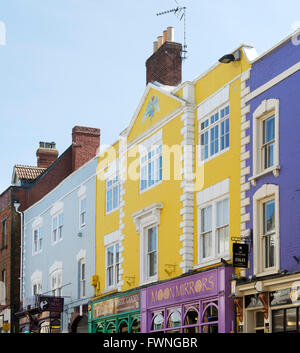 Colourful shop fronts in the high street. Glastonbury, Somerset, England Stock Photo