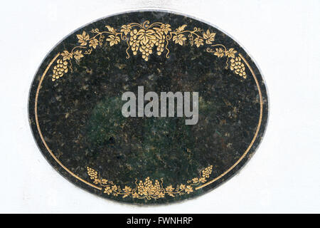 Mable Plate on White Wall Stock Photo