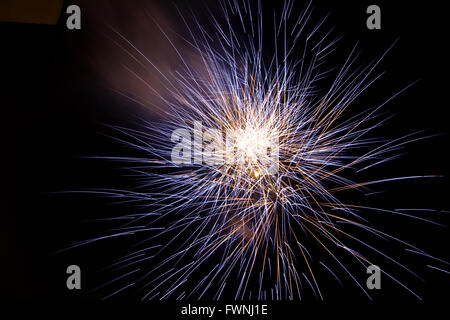 Closeup of Blue Fireworks on dark sky Stock Photo