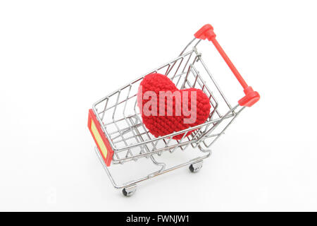 love delivery concept, red heart in Shopping cart isolated on white Stock Photo