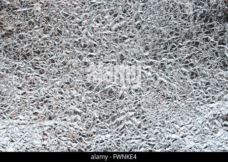 Pattern of Wrinkled Food Aluminum Foil Paper using as background Stock Photo