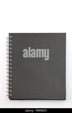 isolated black hard cover notebook with ring binder on white Stock Photo