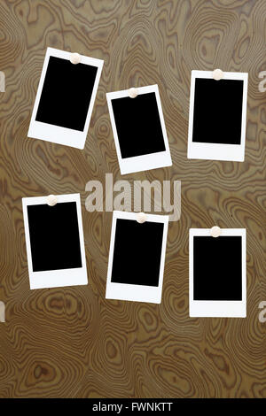 six blank polaroids frames on a wood background Stock Photo
