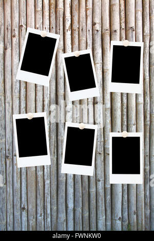 six blank polaroids frames on a bamboo background Stock Photo