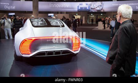 Berlin, Germany. 06th Apr, 2016. Visitors look at a Concept IAA (short for Intelligent Aerodynamic Automobile) at the shareholders' meeting of German car manufacturer Daimler in Berlin, Germany, 06 April 2016. Following a record year, Mercedes-Benz plans to reward shareholders with a high dividend payout. Photo: BERND VON JUTRCZENKA/dpa/Alamy Live News Stock Photo