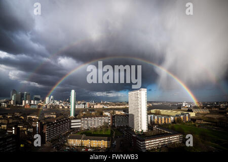 London, UK. 6th April, 2016. UK Weather: Colourful rainbow breaks during a sunset rainstorm over south east London Credit:  Guy Corbishley/Alamy Live News Stock Photo