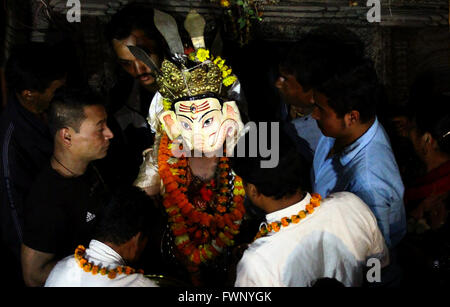 Kathmandu, Nepal. 06th Apr, 2016. A masked dancer dressed up as deity comes out to participate in the 'Devi Pyankha' (Devi Dance in local language) to mark the Ghode Jatra (horse racing festival) in Kathmandu, Nepal. © Archana Shrestha/Pacific Press/Alamy Live News Stock Photo