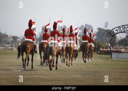 Kathmandu, Nepal. 7th Apr, 2016. Nepalese Army soldiers ride on their horses during Ghode Jatra festival or Horse Parade in Tundikhel grounds, Kathmandu, Nepal on Thursday, April 7, 2016. According to myths it is said that Ghode Jatra is celebrated as triumph over demon that once was a horror in the city and by galloping horses the demon spirit stays under the ground. Credit:  Skanda Gautam/ZUMA Wire/Alamy Live News Stock Photo