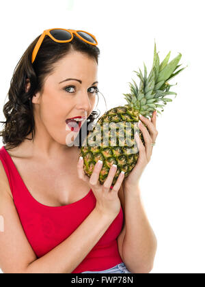 Healthy Happy Young Woman Holding A Fresh Whole Pineapple Isolated Against A White Background Stock Photo