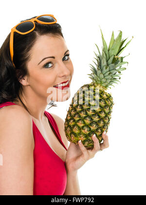 Healthy Happy Young Woman Holding A Fresh Whole Pineapple Isolated Against A White Background Stock Photo
