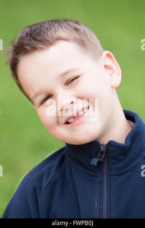 little boy with a torn front first milk tooth Stock Photo