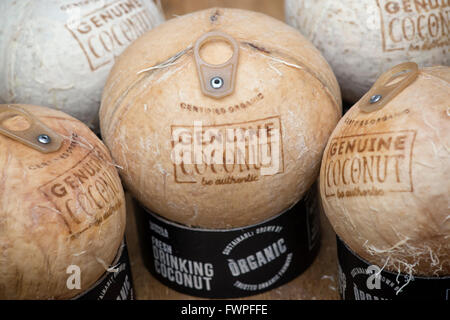Marks and Spencers organic drinking coconuts with ring pulls Stock Photo