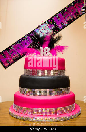 A teenage girl's 18th birthday party pink cake, UK Stock Photo