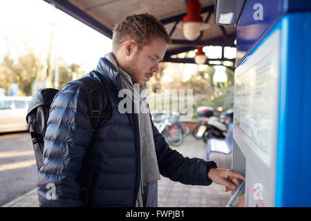 A MALE PASSENGER BUYING TRAIN TICKET FROM THE TICKET OFFICE Stock Photo ...