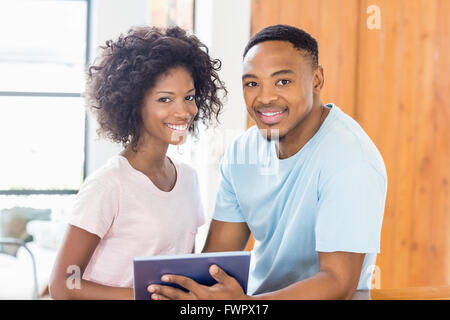 Happy couple using digital tablet Stock Photo