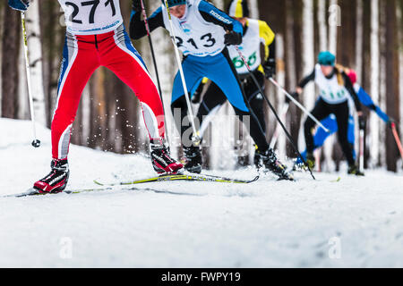 Kyshtym, Russia -  March 26, 2016: group of male skiers going uphill during Championship on cross country skiing Stock Photo