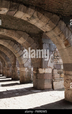 Empty stone gallery with arcs and columns. Ruins of Ancient city Smyrna. Izmir, Turkey Stock Photo