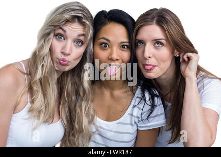 Multiethnic women making funny faces Stock Photo