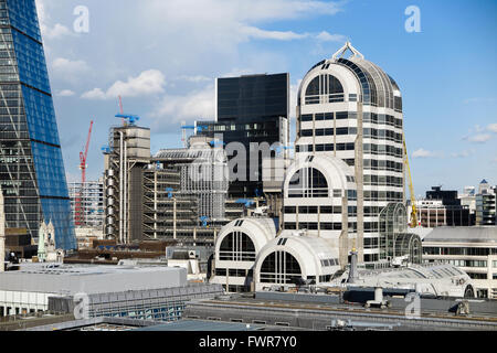 The art deco Twenty Gracechurch Street and the Lloyds Building in the insurance district of City of London EC3 on a sunny day with blue sky and clouds Stock Photo