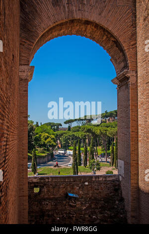 View through an arch of the Colosseum on the square Colosseum Stock Photo