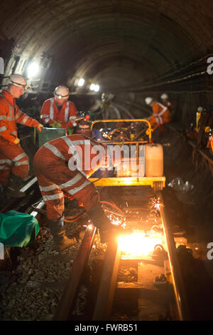 Engineers weld replacement track components together using thermite ...