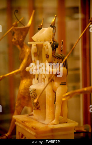 Carved alabaster ornament showing two men holding an urn Egyptian Museum of Antiquities Cairo Egypt Stock Photo