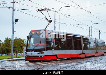 PRAGUE, CZECH REPUBLIC - AUGUST 25, 2015: High-tech trams Skoda on the bridge Manesuv most in the district Mala Strana Prague's Stock Photo