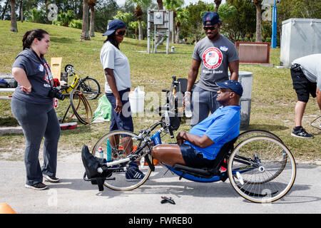 Miami Florida,Tropical Park,Paralympic Experience,sports,hand,cycle,Black adult,adults,man men male,disabled,volunteer volunteers volunteering work wo Stock Photo