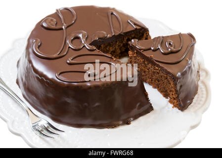 traditional sacher cake sliced on white plate Stock Photo