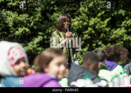 U.S First Lady Michelle Obama addresses student helpers before planting the White House Kitchen Garden April 5, 2016 in Washington, DC. This year the garden used several varieties of vegetables that were grown on the International Space Station. Stock Photo