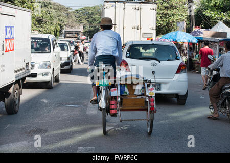 Rickshaw driver, Yangon, Myanmar Stock Photo