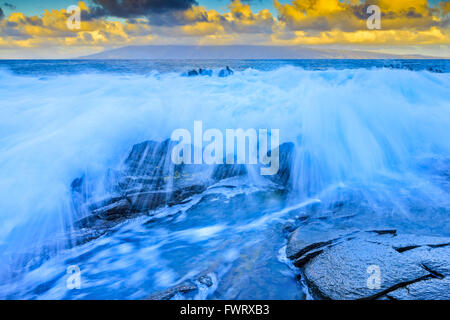 time exposure shot of waves on beach in Maui at sunset Stock Photo
