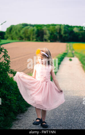 Little girl in the fields Stock Photo - Alamy