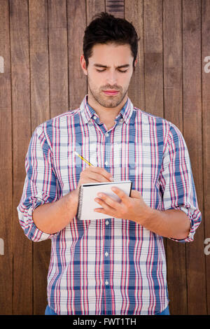 Man writing in a diary Stock Photo
