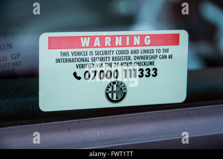 A warning sign on an Alfa Romeo's window Stock Photo