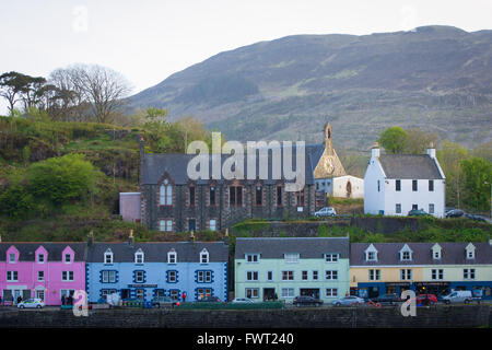 A view of the colourful shops and church of Portree harbour on the Isle of Skye in Scotland. Stock Photo