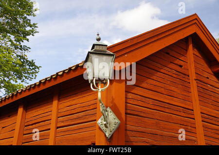Lantern on an old red wooden house in Linköping, Sweden Stock Photo