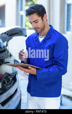 Male engineering checking clipboard Stock Photo
