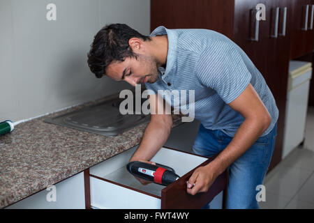 Man using cordless hand drill Stock Photo
